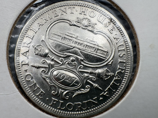 1927 Canberra King George V Florin Coin in a 2x2 holder, showing the obverse and reverse sides, with a detailed portrait of the king and various designs around the edge.